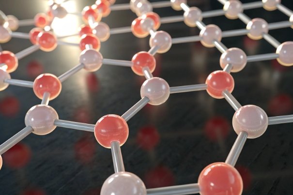 Polymer molecular lattice with red and white nodes under bright laboratory lighting