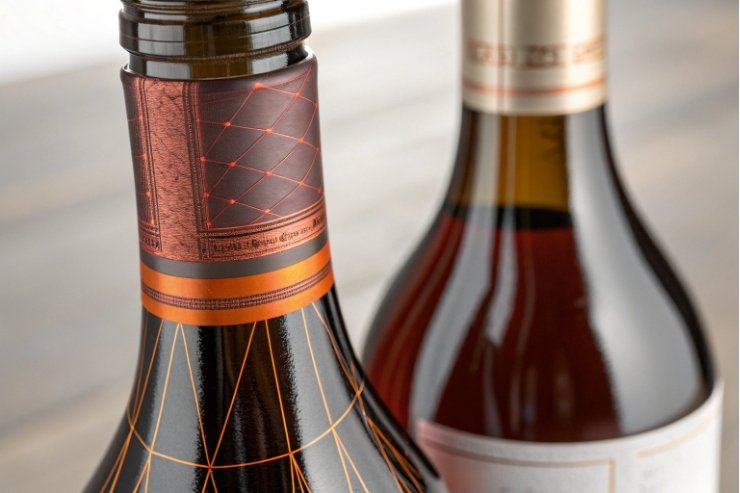 premium bottle neck label close-up with metallic foil and geometric pattern