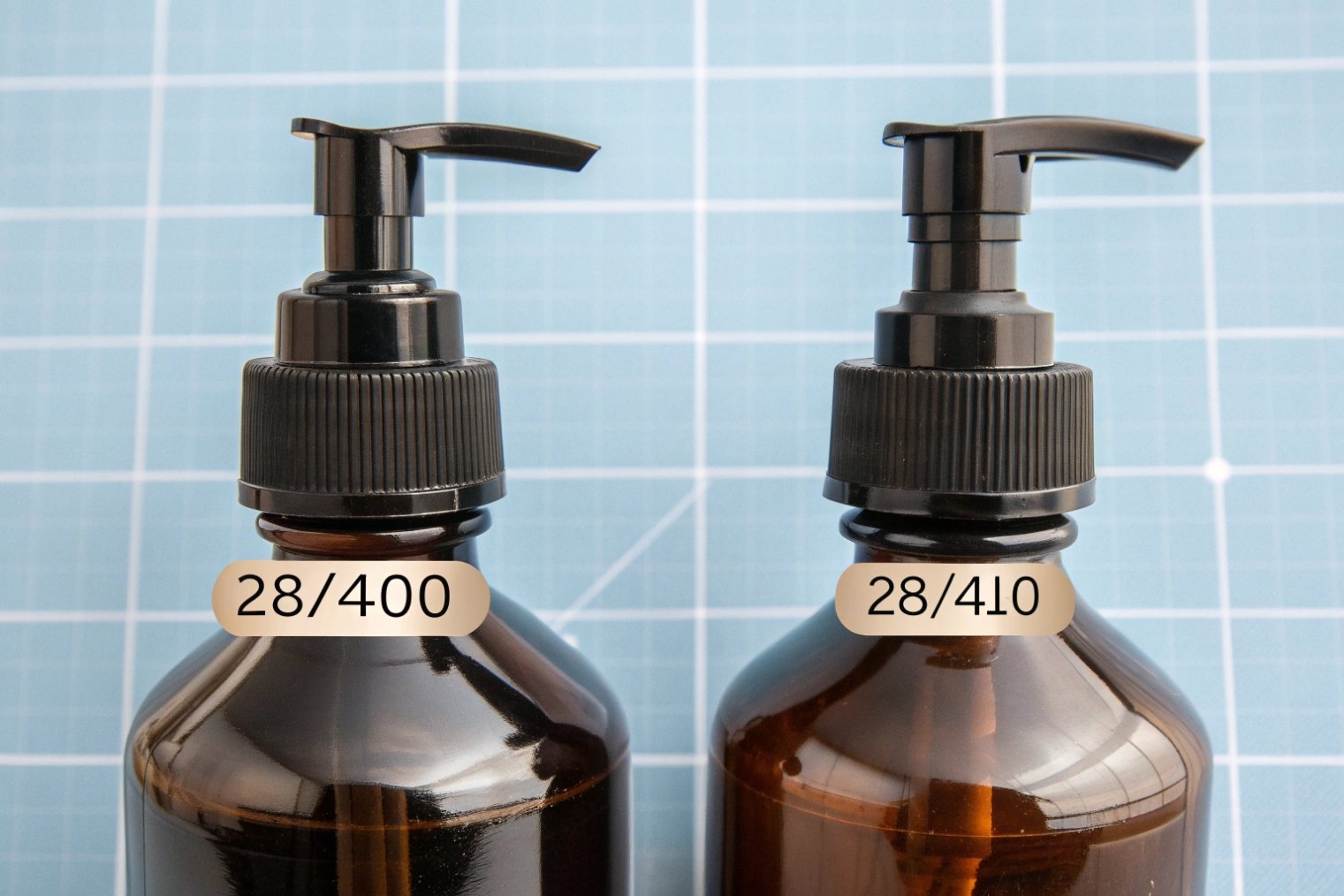 comparison of 28 400 and 28 410 black lotion pumps on amber bottles