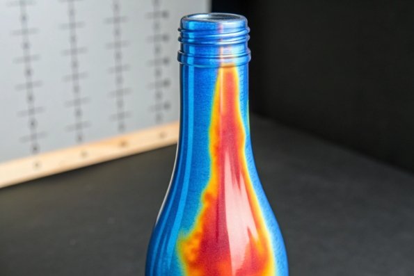 Thermal imaging view of glass bottle neck showing heat distribution and stress pattern