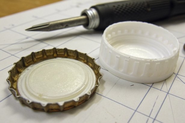 Cap component design Metal crown cap and plastic closure parts on blueprint with screwdriver tool