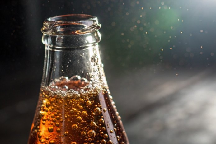 Macro view inside FuSenglass beverage bottle showing smooth surface and chemical resistance