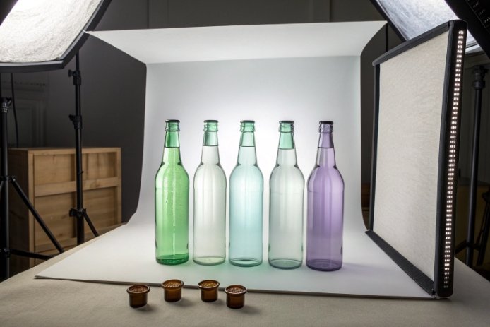 Studio photo of colored glass bottles for packaging design and tint comparison