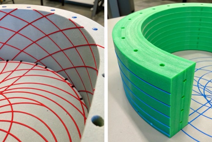 Thermal stress simulation molds showing red stress lines and green prototype tooling parts