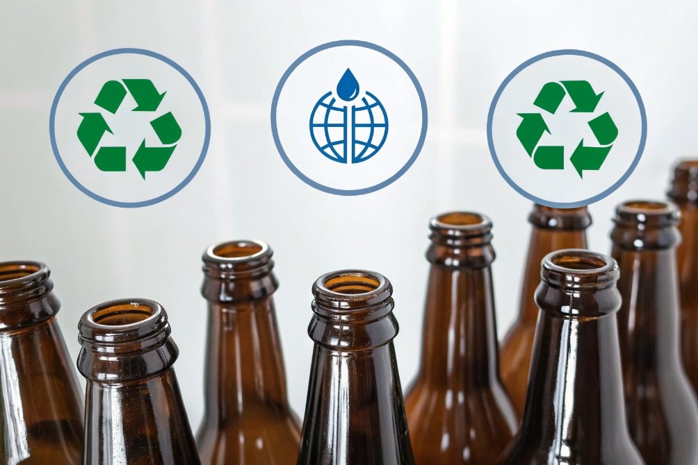 Recycling, water, and recycling symbols on glass bottles