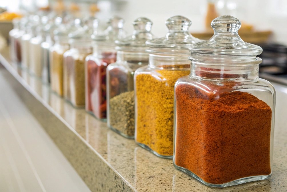 Spice jars lined up on countertop