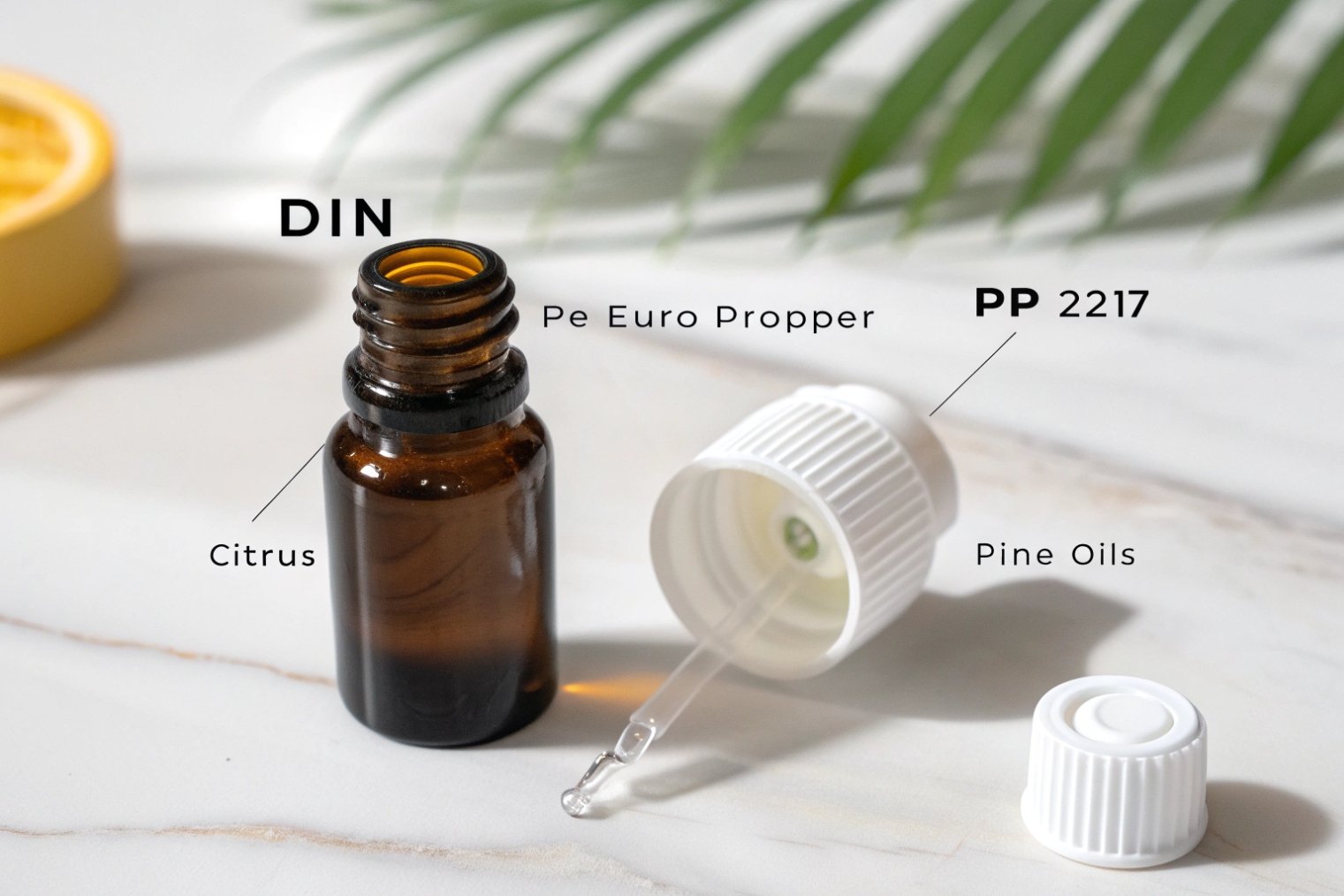 DIN-neck amber essential oil bottle with Euro dropper insert and PP 2217 cap labeled for citrus and pine oils