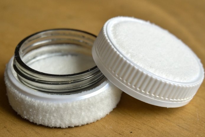 Close-up of jar lid liner and gasket showing seal cushioning material for closure