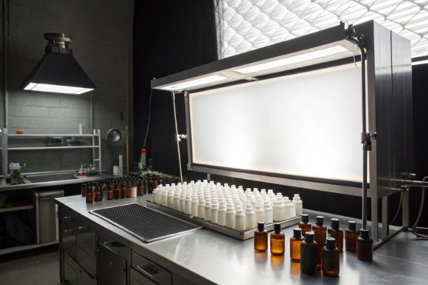 Lightbox QC Station Quality inspection lightbox station with white bottles and amber vials for packaging testing