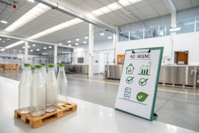 Glass bottle safety sign showing no arsenic compliance in clean packaging facility