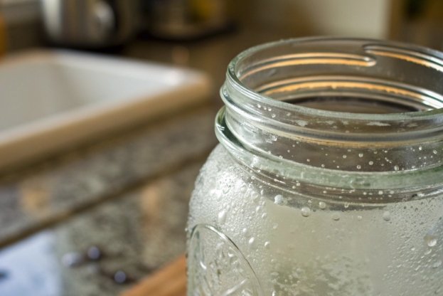 close up of wide mouth glass mason jar for home canning in kitchen