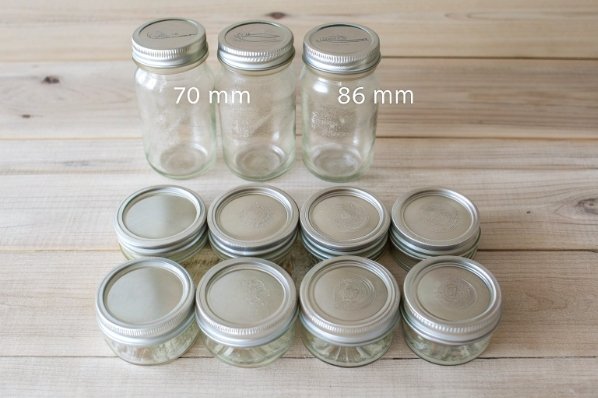 clear glass jars with metal lids showing 70mm and 86mm mouth sizes