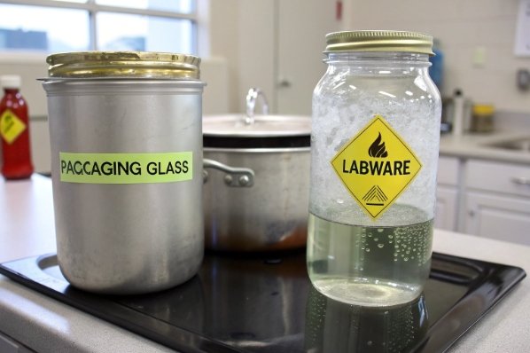 laboratory comparison of packaging glass container and labware mason jar with hot liquid