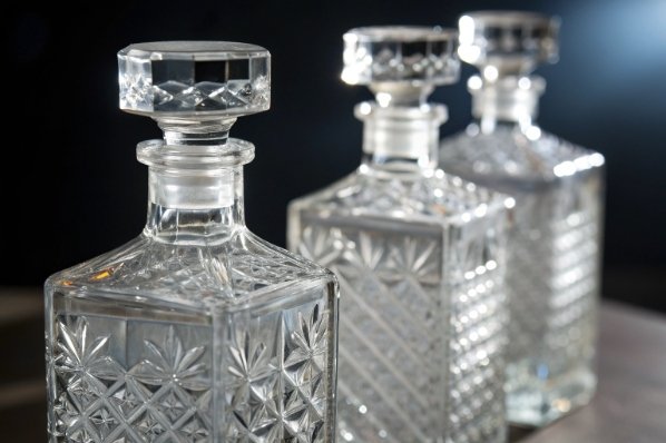 elegant cut crystal glass decanters for whisky and spirits on table