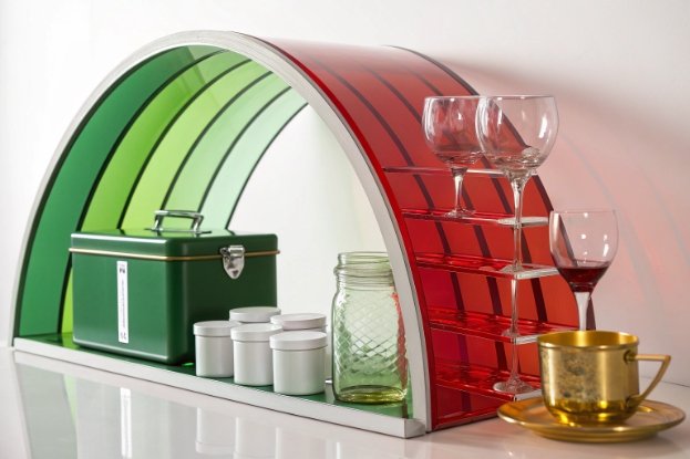 Arched rainbow shelf displaying wine glasses, mason jar, tins and cup