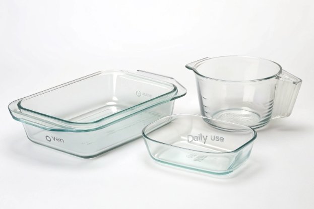 Oven-safe borosilicate baking dish, casserole, and measuring jug isolated