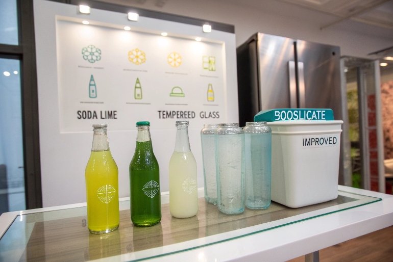 Comparison of soda lime tempered and borosilicate glass bottles with colorful drinks