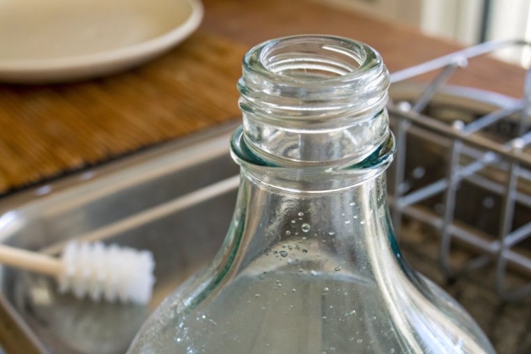 Close up of threaded glass bottle neck showing smooth finish