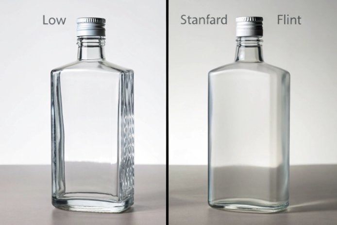 Low-iron flint and standard flint glass liquor bottles compared on white background